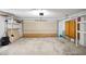 Spacious garage with overhead door and some shelving at 5639 Blount Ave, Sarasota, FL 34231