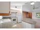 Bright kitchen features granite counters, white appliances, and tiled floors at 5639 Blount Ave, Sarasota, FL 34231