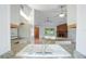 Bright kitchen view featuring granite counters and stainless steel faucet at 5639 Blount Ave, Sarasota, FL 34231
