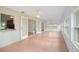Spacious living room featuring french doors and wall-to-wall windows at 5639 Blount Ave, Sarasota, FL 34231
