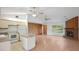 Open-concept living space showcasing the kitchen, dining area, brick fireplace and seamless flow throughout the home at 5639 Blount Ave, Sarasota, FL 34231