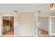 Spacious living room featuring french doors that lead to the kitchen at 5639 Blount Ave, Sarasota, FL 34231