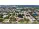 Beautiful community featuring homes surrounding a pond and mature landscaping providing a serene living environment at 5698 Country Walk Ln, Sarasota, FL 34233