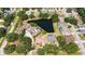 Tranquil home setting near a peaceful pond and surrounded by mature trees in a friendly neighborhood at 5698 Country Walk Ln, Sarasota, FL 34233