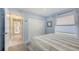 Bedroom featuring a large closet and access to a hallway at 5698 Country Walk Ln, Sarasota, FL 34233