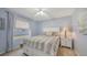 Cozy bedroom with a soft color palette and plush bedding at 5698 Country Walk Ln, Sarasota, FL 34233