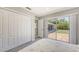 Bright bedroom with a sliding door to the outdoors and double closets at 5698 Country Walk Ln, Sarasota, FL 34233