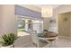 Bright dining area with table, chairs, and a large window offering a view at 5698 Country Walk Ln, Sarasota, FL 34233