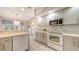 Bright kitchen features modern appliances, ample countertop space, and stylish cabinets with contemporary hardware at 5698 Country Walk Ln, Sarasota, FL 34233