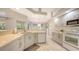 Bright kitchen featuring tile floor, granite counters, and stainless appliances at 5698 Country Walk Ln, Sarasota, FL 34233
