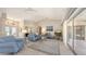 Open living room featuring tile floors, vaulted ceilings, and lots of natural light at 5698 Country Walk Ln, Sarasota, FL 34233