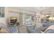 Open living space with natural light, backyard view, and breakfast bar at 5698 Country Walk Ln, Sarasota, FL 34233