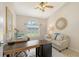 Office space featuring a couch, ceiling fan, and natural lighting at 5698 Country Walk Ln, Sarasota, FL 34233