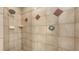Bathroom shower featuring tile with accent diamonds at 5698 Country Walk Ln, Sarasota, FL 34233