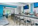 Upscale bar with lots of seating, TVs, and wine display creates a luxurious ambiance at 5787 Ivrea Dr, Sarasota, FL 34238