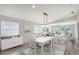 Stylish dining area with contemporary furnishings and bright, airy atmosphere at 5787 Ivrea Dr, Sarasota, FL 34238