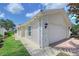 Home exterior showcasing the attached two-car garage and manicured lawn at 5787 Ivrea Dr, Sarasota, FL 34238