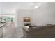 Tastefully furnished living room with light floors, modern decor, and cozy seating at 5787 Ivrea Dr, Sarasota, FL 34238