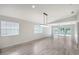 Bright living space with modern floors and expansive windows, perfect for relaxing at 5787 Ivrea Dr, Sarasota, FL 34238