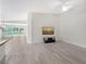 Open-concept living space with sleek floors, natural light, and serene ambiance at 5787 Ivrea Dr, Sarasota, FL 34238