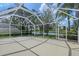 Covered patio with a view of the lake and lush greenery at 5787 Ivrea Dr, Sarasota, FL 34238
