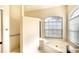 Primary bathroom with a soaking tub, and a shower, and a private toilet area at 5905 32Nd E St, Ellenton, FL 34222