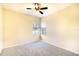 Cozy bedroom with carpeted floor, ceiling fan, and natural light through windows at 5905 32Nd E St, Ellenton, FL 34222