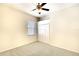 Neutral bedroom with carpet, window, ceiling fan, and closet with bi-fold doors at 5905 32Nd E St, Ellenton, FL 34222
