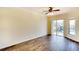 Spacious bedroom with wood floors, ceiling fan, and sliding glass door to the lanai at 5905 32Nd E St, Ellenton, FL 34222