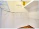 Walk-in closet with shelving units, hanging racks, and wood floors at 5905 32Nd E St, Ellenton, FL 34222