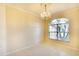 Cozy living room with neutral walls, tile flooring, chandelier, and a large window at 5905 32Nd E St, Ellenton, FL 34222
