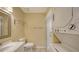This bathroom features a stacked washer/dryer and a walk-in shower at 631 N Orange Ave # 208, Sarasota, FL 34236