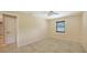 This neutral bedroom includes tile floors and a window with bright light at 631 N Orange Ave # 208, Sarasota, FL 34236