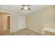 This bedroom has tile floors, a ceiling fan, and closet at 631 N Orange Ave # 208, Sarasota, FL 34236