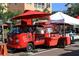 A charming red coffee truck with signage, offering coffee, frappes, and smoothies at the local market at 631 N Orange Ave # 208, Sarasota, FL 34236