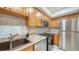Bright kitchen featuring stainless steel appliances and granite countertops at 631 N Orange Ave # 208, Sarasota, FL 34236
