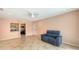 Bright living room featuring tile floors, ceiling fan, and open access to the kitchen at 631 N Orange Ave # 208, Sarasota, FL 34236