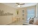 This sitting room features a ceiling fan and tile floors at 631 N Orange Ave # 208, Sarasota, FL 34236