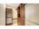 This walk-in closet is equipped with custom shelving and storage drawers at 631 N Orange Ave # 208, Sarasota, FL 34236