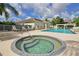 Relax in the community's inviting hot tub, adjacent to the pool, a perfect spot to unwind at 6335 Bay Cedar Ln, Bradenton, FL 34203