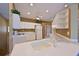 Well-lit kitchen featuring white cabinetry, modern appliances, and ample counter space for meal preparation and storage at 6335 Bay Cedar Ln, Bradenton, FL 34203
