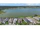 Aerial view of lakefront property with neighboring houses, offering scenic waterfront living at 6349 Isla Del Ray Ave, Sarasota, FL 34240