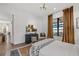 Bright bedroom with modern decor, large window overlooking the water, and wood floors at 6349 Isla Del Ray Ave, Sarasota, FL 34240