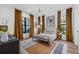 Bright bedroom with large windows, stylish furnishings, and wood floors, creating a serene retreat at 6349 Isla Del Ray Ave, Sarasota, FL 34240