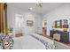 Bright bedroom with modern decor, and wood floors, leading into the bathroom and other living areas at 6349 Isla Del Ray Ave, Sarasota, FL 34240