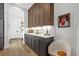 This Butler's Pantry features beautiful cabinetry, undermount lighting, quartz countertops, and views into the home's entry at 6349 Isla Del Ray Ave, Sarasota, FL 34240