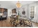 Dining area features modern light fixture, decor, and a table with seating for six at 6349 Isla Del Ray Ave, Sarasota, FL 34240