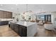 Spacious kitchen island boasts bar seating and views of the open living space with water views at 6349 Isla Del Ray Ave, Sarasota, FL 34240