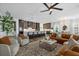 Spacious open-concept living area with a large kitchen island and stylish furnishings at 6349 Isla Del Ray Ave, Sarasota, FL 34240