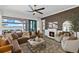 The living room features a fireplace, ceiling fan, and sliding doors to screened patio at 6349 Isla Del Ray Ave, Sarasota, FL 34240